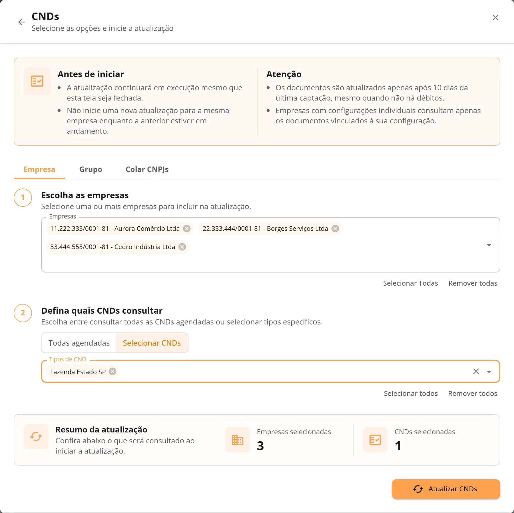 Janela Atualizar CNDs aberta pela aba CNDs, com os quadros Antes de iniciar e Atenção, as três empresas Aurora, Borges e Cedro escolhidas, o modo Selecionar CNDs e o tipo Fazenda Estado SP escolhido